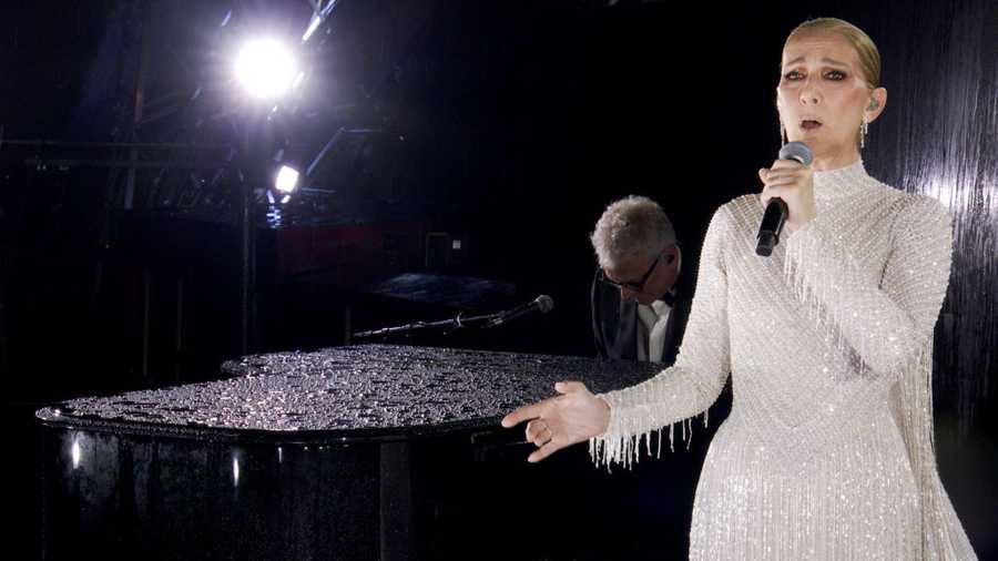 PARIS, FRANCE - JULY 26: (EDITOR&apos;S NOTE: This Handout screengrab was provided by a third-party organization and may not adhere to Getty Images&apos; editorial policy.) This handout released by the Olympic Broadcasting Services, shows a view of singer Celine Dion performing on the Eiffel Tower during the opening ceremony of the Paris 2024 Olympic Games Paris 2024 on July 26, 2024 in Paris, France. (Screengrab by IOC via Getty Images)